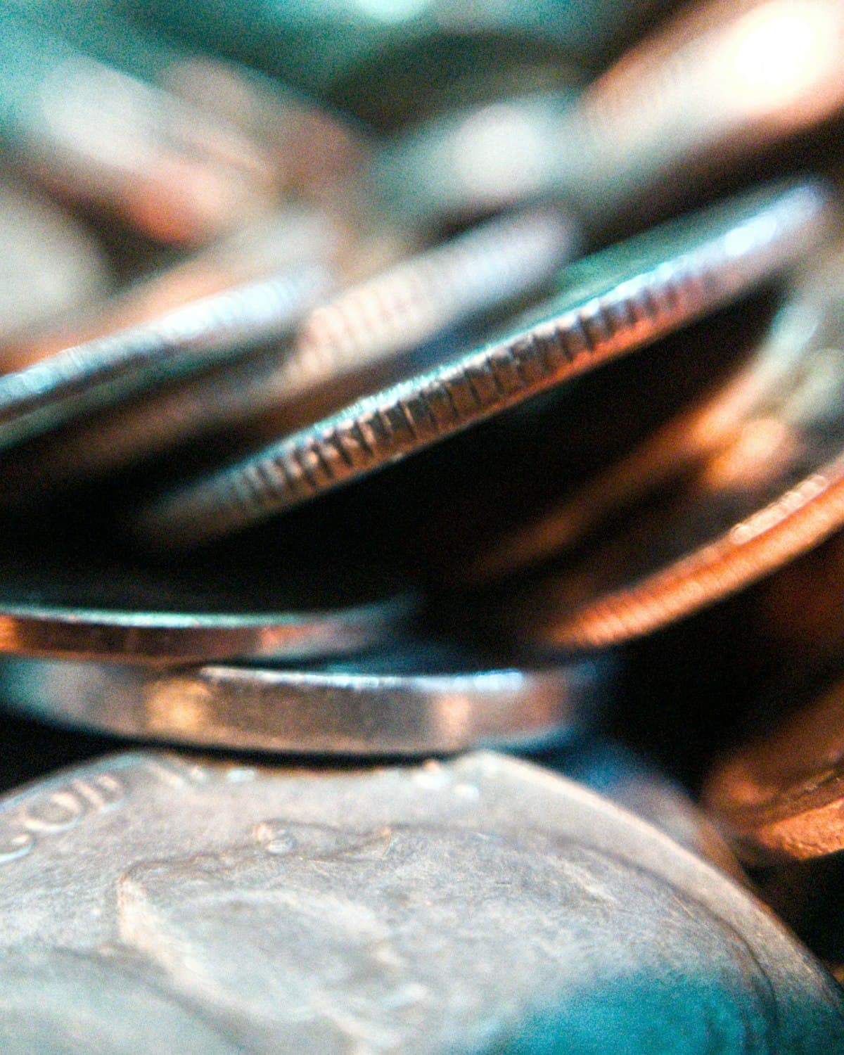 Silver coins stacked under soft, directional case light during an appraisal
